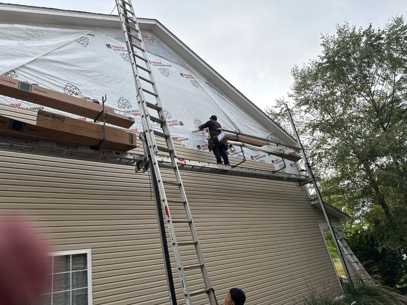 Storm-damaged siding documented in The Hawthorns